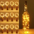 thumbnail image 1 of [12 piezas] Cadena de luces LED para botellas, 2 m, 20 luces LED impermeables para botellas, alambre de cobre flexible para decoración de Halloween, Navidad, fiestas, bodas, jardín, césped, blanco cál, 1 of 5