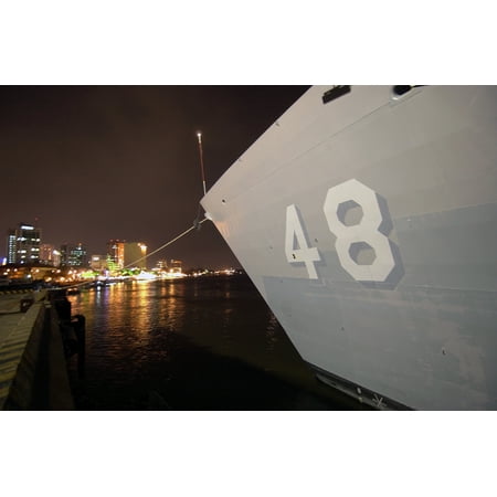 LAMINATED POSTERThe hull number on the bow of USS Vandegrift (FFG 48) is visible over the city lights of Ho Chi Minh Poster Print 24 x