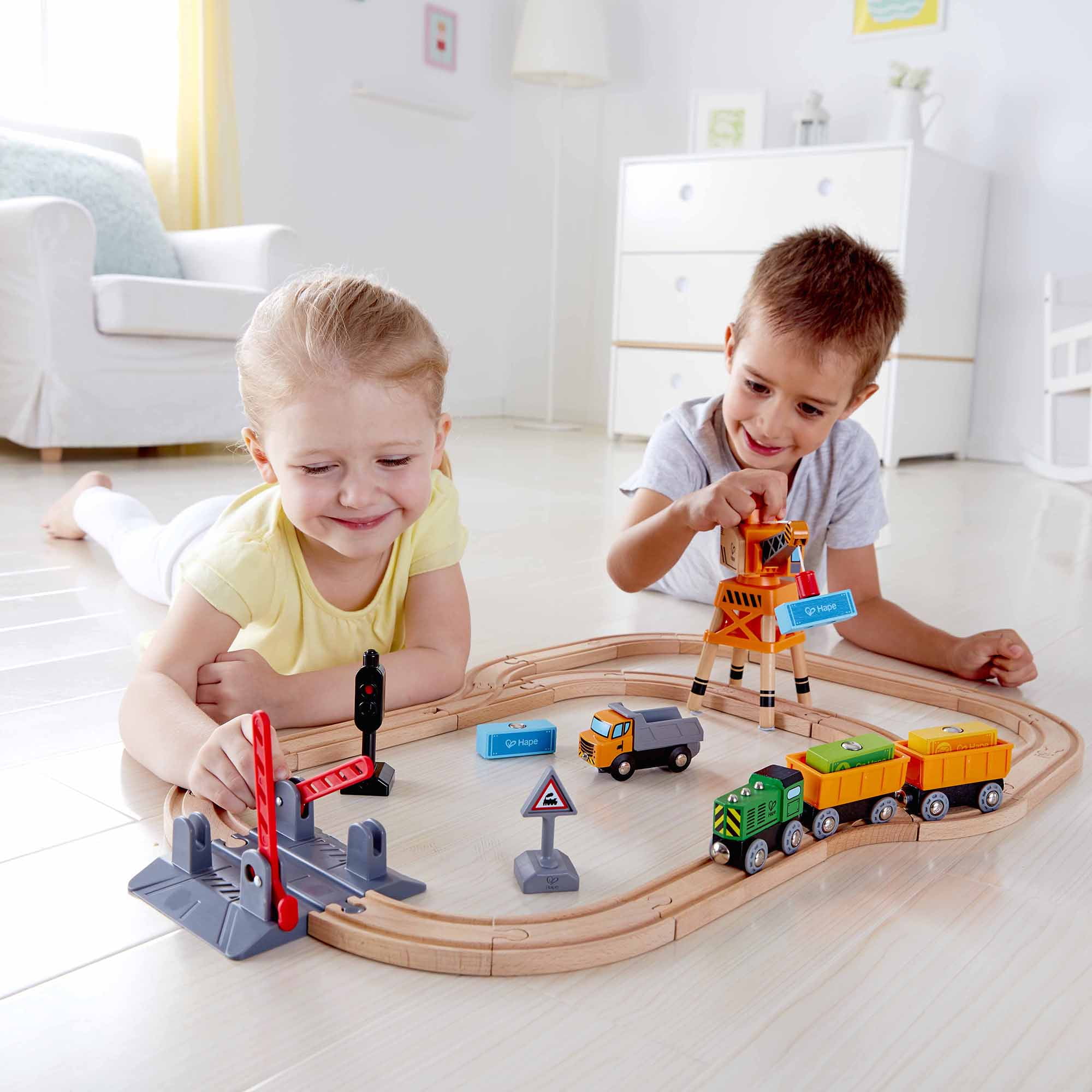 Hape: Crossing & Crane Set - 32pc Wooden Train Cargo Railroad Yard, Magnetic Linking Trains, Crane To Grab & Move Cargo, Accessories, Kids Ages 3+