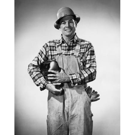 Construction worker holding a lunch box and smiling Stretched Canvas -  (18 x