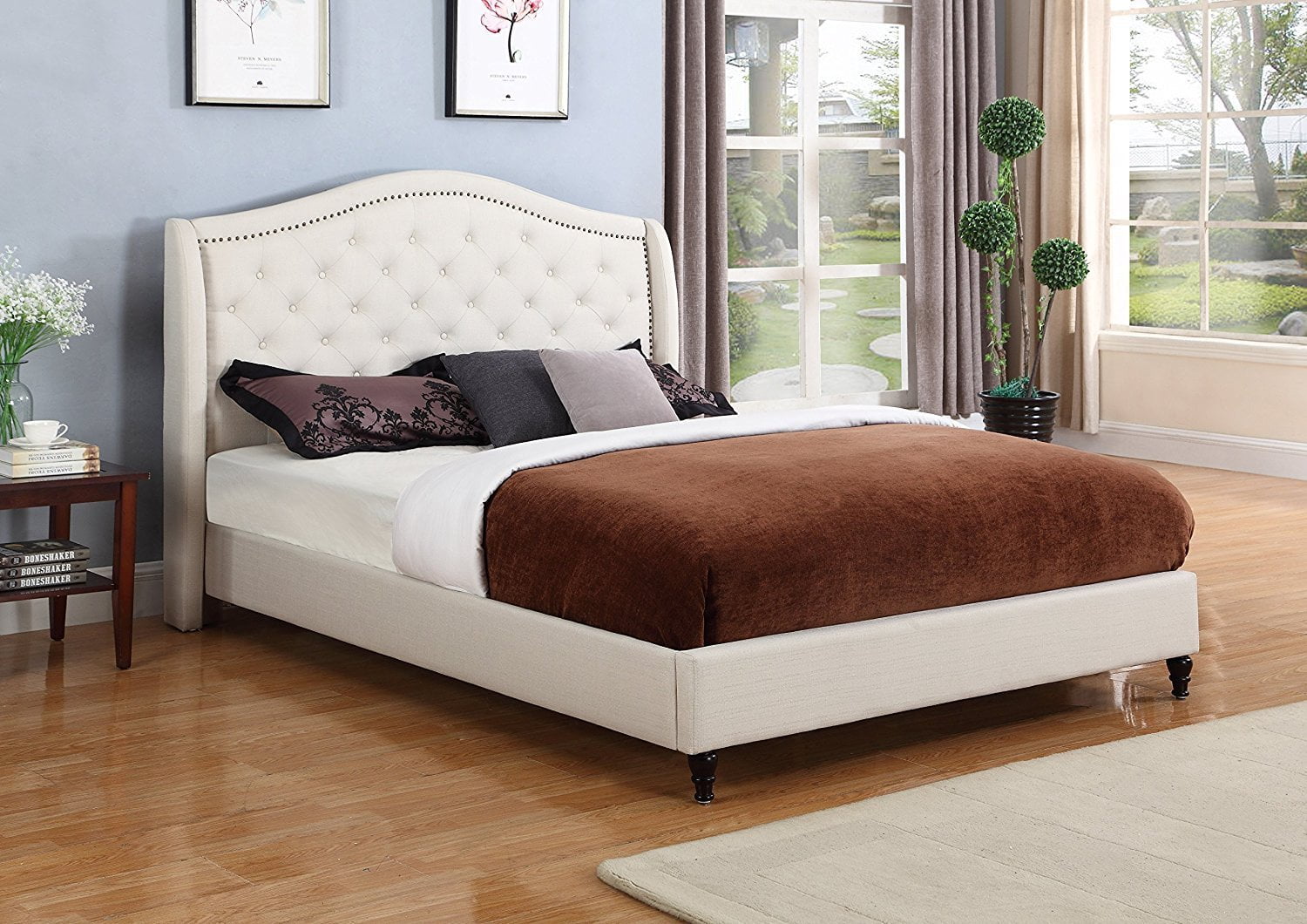 cream tufted bed