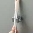 thumbnail image 1 of Percha de fregona sin agujeros montada en la pared | Gancho organizador de fregona adhesivo fuerte | Plástico ABS duradero | Tamaño compacto de 2,36 x 2,36 x 2,36 pulgadas | Uso en múltiples, 1 of 6