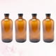 thumbnail image 3 of 4 botellas Boston redondas de vidrio rellenables de 30 ml, color ámbar y marrón, con tapa de baquelita negra., 3 of 7