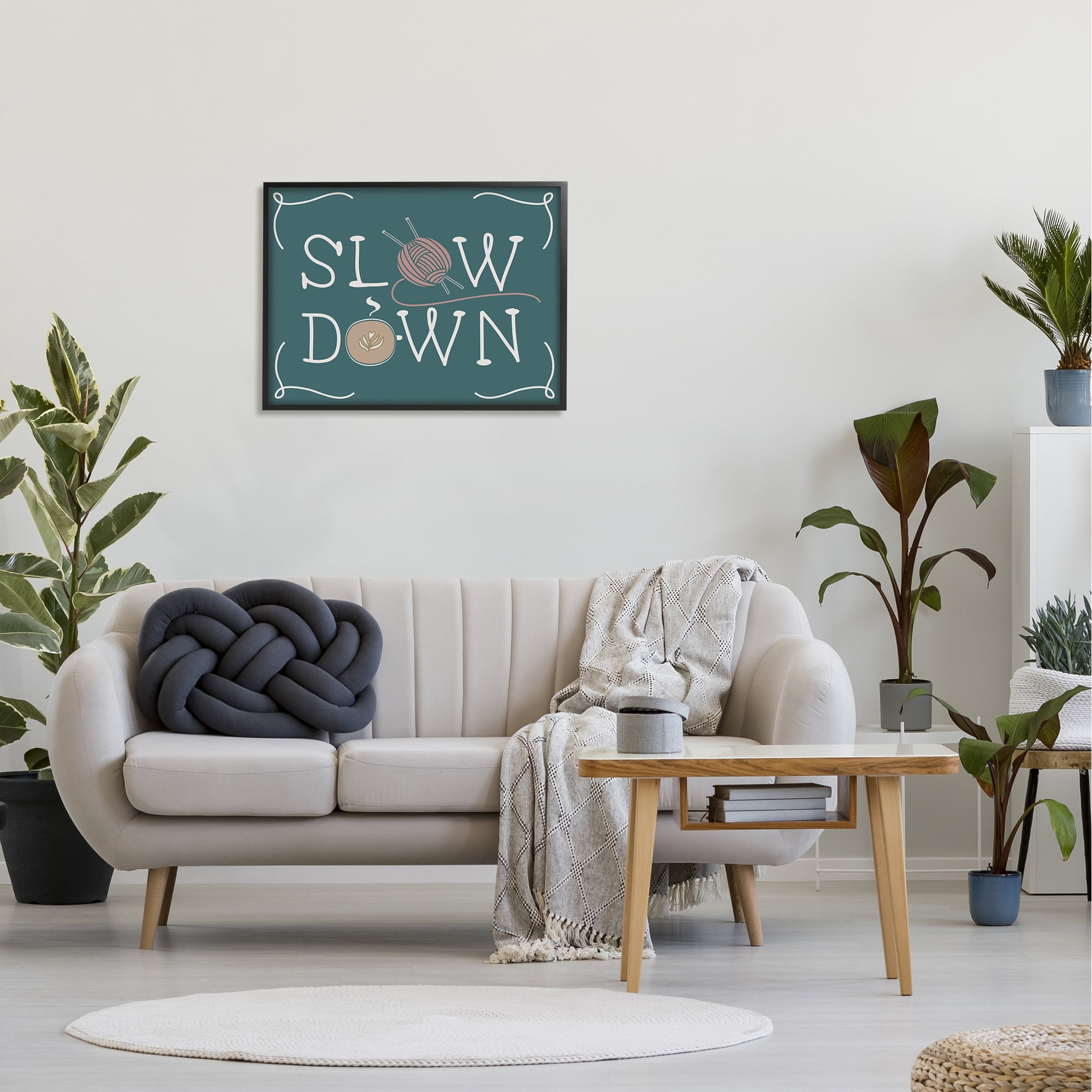 The Stupell Home Decor Teal Slow Down Hygge Typography with Yarn and Coffee Illustration Framed Texturized Art