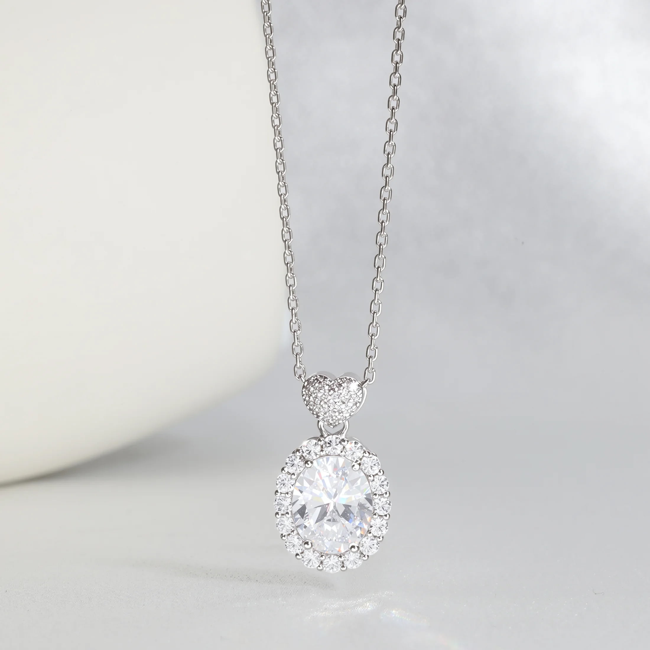 MENGLISI Clear Cubic Zirconia Oval Halo Pendant Necklace for Women, White Gold Plated Copper