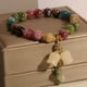 thumbnail image 4 of Pulseras de cristal curativo Pulsera de cuentas-Assote Pulsera de turmalina de color natural, Colgante de flor de lirio de los valles tallado a mano, 4 of 5