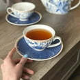 thumbnail image 6 of STP GOODS Melodie de Fleurs Porcelain Cup and Saucer Set of 4 pcs 11.83 fl oz (350 ml) Service for 4 Kitchen Teacups Floral Tea Cups Tea Cup with Matching Saucer, Blue and White, 6 of 9