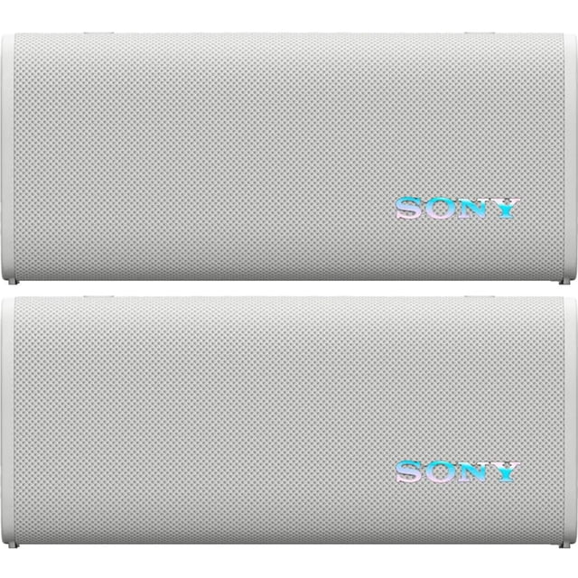 altavoz bluetooth portátil inalámbrico sony srsult30/w ult blanco, vista frontal de dos unidades apiladas con parrilla perforada y logo SONY iridiscente; diseño compacto horizontal con bordes redondeados, patas pequeñas visibles y malla texturizada, ideal para fiestas al aire libre con Party Connect y también apto como altavoz portátil para ciclismo o paseos.