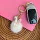 thumbnail image 5 of Llavero blanco - colgante de conejito tierno, bolso de llavero, juguetes de peluche, decoración de llaves de coche, colgante inflable, 5 of 6