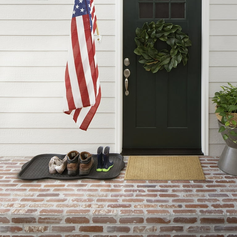 Front door boot outlet tray