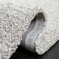 thumbnail image 4 of SAFAVIEH Ultimate Atanas Solid Plush Polyester Shag Area Rug, Sand/Ivory, 4' x 6', 4 of 8