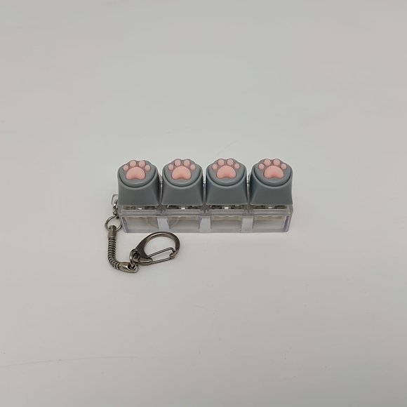 Llavero colgante de dibujos animados con tecla de pata de gato, llavero novedoso, juguete para aliviar el estrés, accesorio para presionar con la yema del dedo, dije para bolso, botón divertido