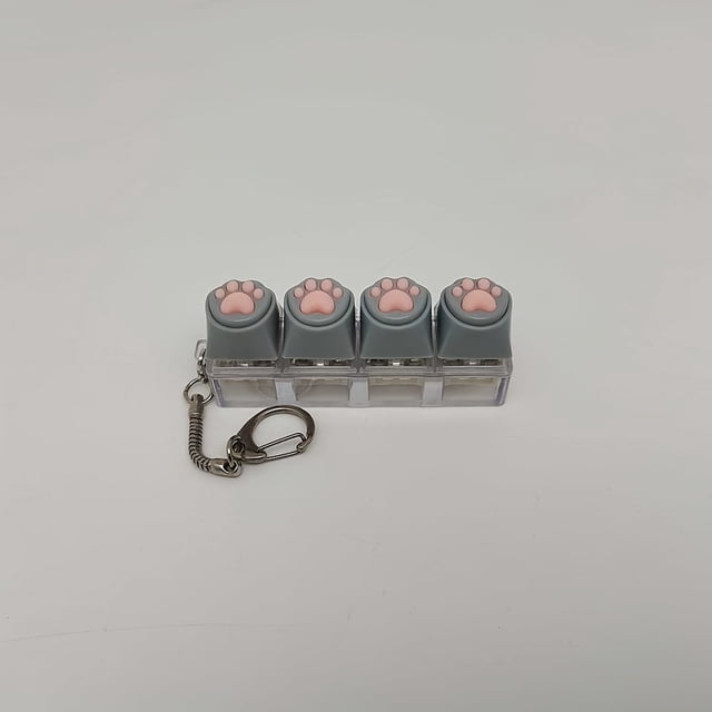 Llavero colgante de dibujos animados con tecla de pata de gato, llavero novedoso, juguete para aliviar el estrés, accesorio para presionar con la yema del dedo, dije para bolso, botón divertido