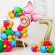 thumbnail image 1 of Set de 82 globos para fiesta de cumpleaños con temática de rosquillas y mariposas, 1 of 1