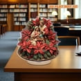 thumbnail image 5 of Rotating acrylic standee features the holy family surrounded by vibrant poinsettias and holly on a round base with stunning details, 5 of 7