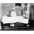 thumbnail image 2 of Public Health Dispensary. Na Patient In A Public Health Dispensary. Photograph November 1920. Poster Print by, 2 of 4