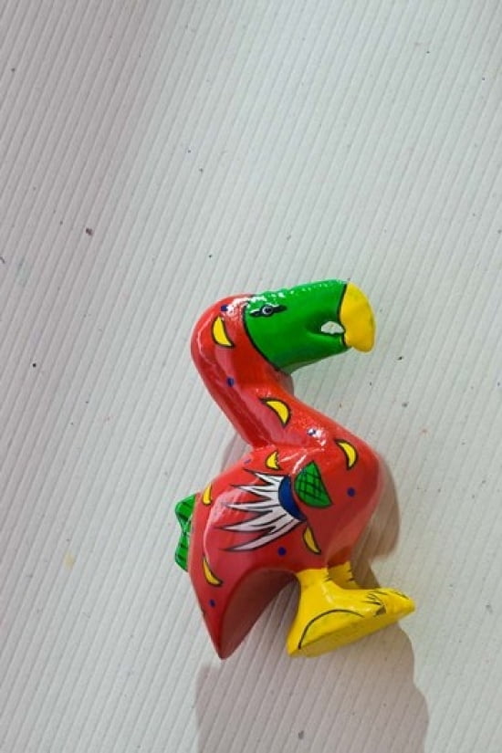 Red wooden Dodo bird toy Mauritius Poster Print by Walter Bibikow