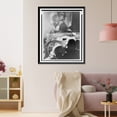 thumbnail image 3 of Historic Framed Print, [Couple kissing at drive-in theater in Rome, Italy where Gary Cooper and Audrey Hepburn are likewise engaged on screen], 17-7/8" x 21-7/8", 3 of 9