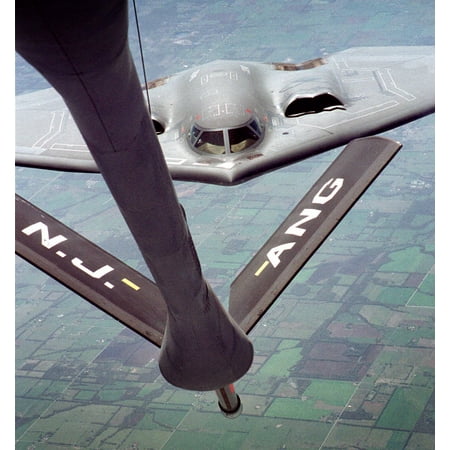 LAMINATED POSTER FILE PHOTOA B-2 Spirit from Whiteman Air Force Base, Mo. pulls up for a fill-up with a KC-135 St Poster Print 24 x
