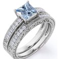 thumbnail image 1 of JeenMata Conj. Nupcial Estilo Eduardiano con Borde Milgrain de 1,75 ct de Aguamarina y Moissanita Corte Princesa Azul Profundo con Pavé de 4 Puntas en Baño de Oro Blanco de 18 K sobre Plata, 1 of 6