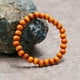 thumbnail image 3 of Nvzi Pulsera elástica con cuentas de madera para hombre, color naranja, 3 of 4
