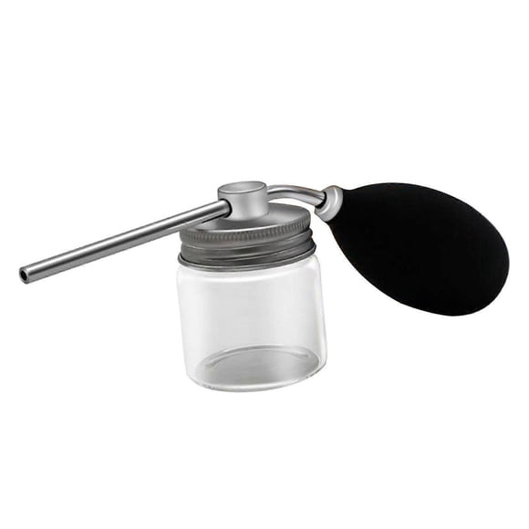 Frasco pulverizador de talco recargable con bomba aplicadora de silicona para fibras capilares que permite un control preciso de la dosis.