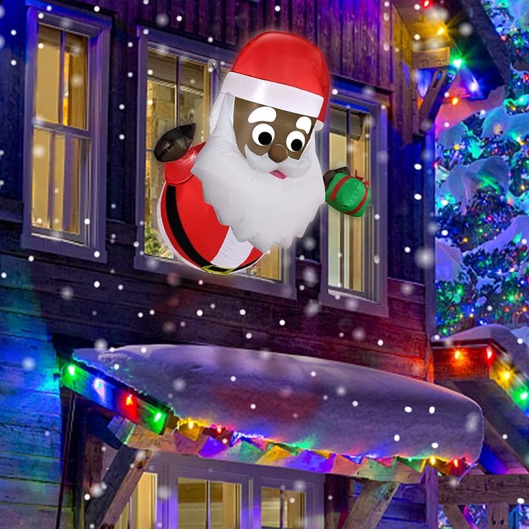 Blow Up Santa Looking In Window