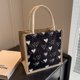 thumbnail image 1 of Bolso de mano de lona con diseño moderno y moderno para estudiantes, lonchera de mano para verano, bolsa para el almuerzo, bolsa para guardar cosméticos, 1 of 6