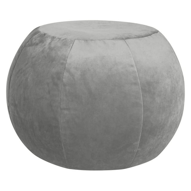 Plump round gray velvet ottoman with stitched panels from Gouchee Home.