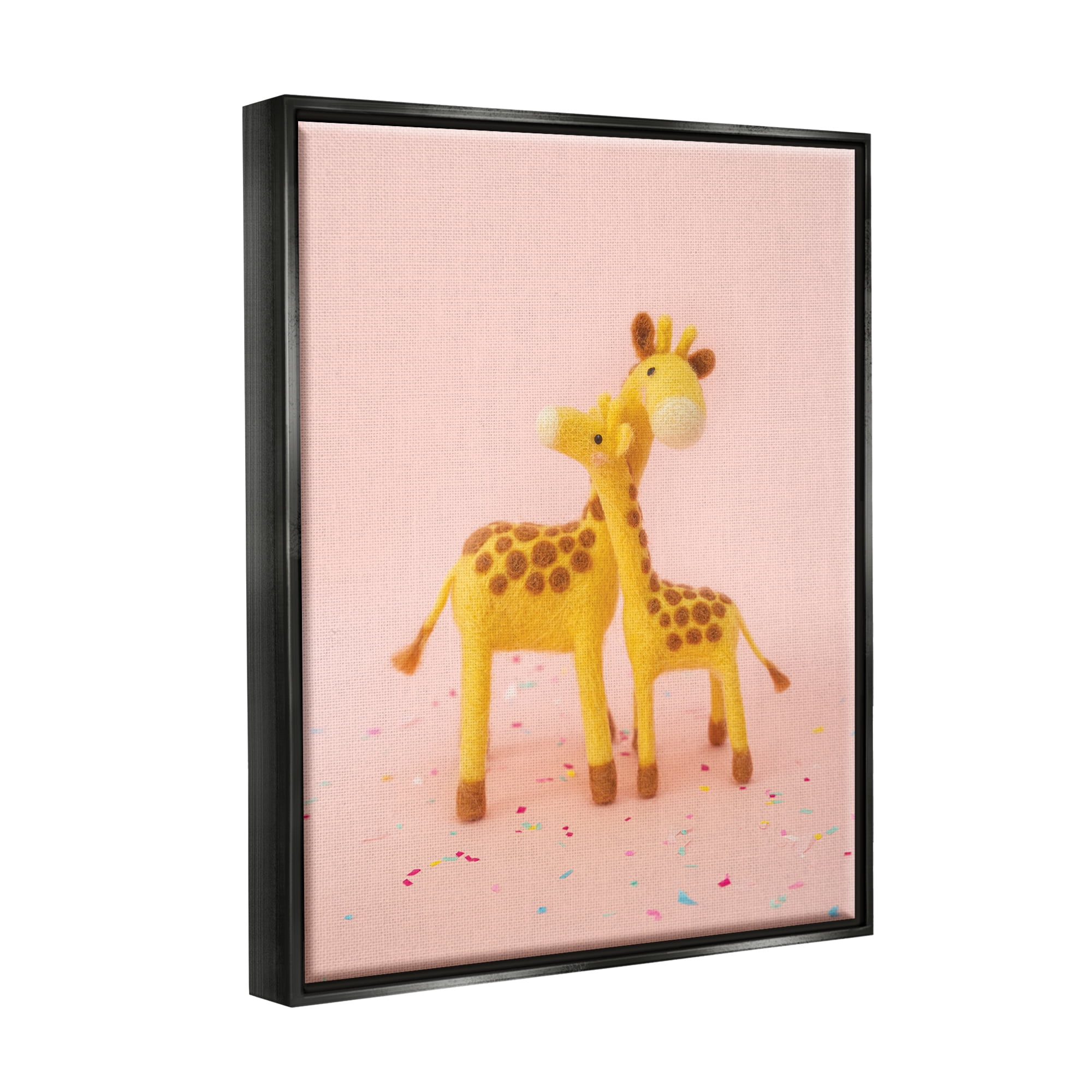 Stupell Industries Pastel Pink Hugging Giraffes Animals & Insects Photography Black Floater Framed Art Print Wall Art