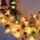 thumbnail image 5 of Hilo de luces navideñas LED con copos de nieve y campanas - Luces verdes decorativas de 200 cm alimentadas por pilas para decoración navideña interior, 5 of 6