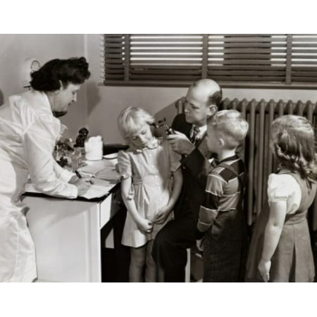 Male doctor examining a girls ear with an otoscope Canvas Art - (18 x 24)