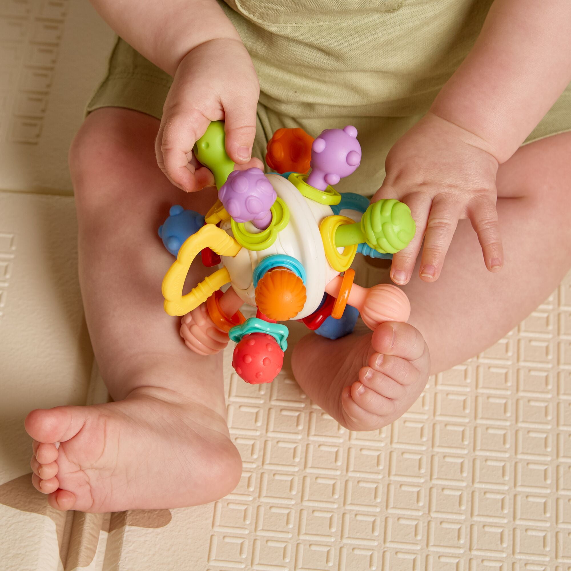 Nuby Textured Twist Ball Baby Teether Infant Toy with Colorful Rattle