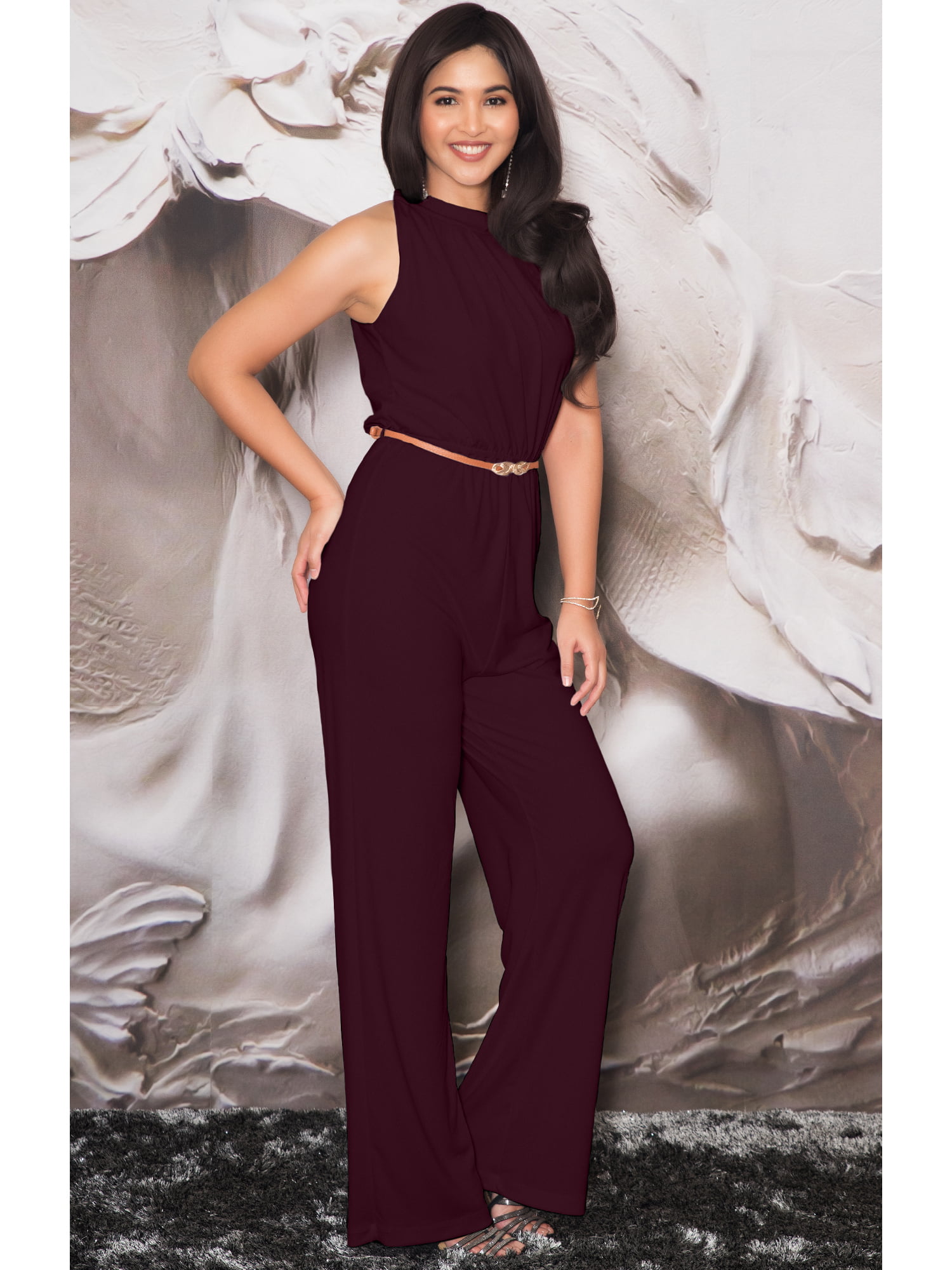 Long red jumpsuit with asymmetric neckline for guest | INVITADISIMA
