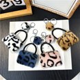 thumbnail image 4 of Llavero con estampado de leopardo para bolso, colgante creativo de peluche de dibujos animados para estudiantes, llavero para coche, colgante de bola de piel, accesorios, 4 of 6