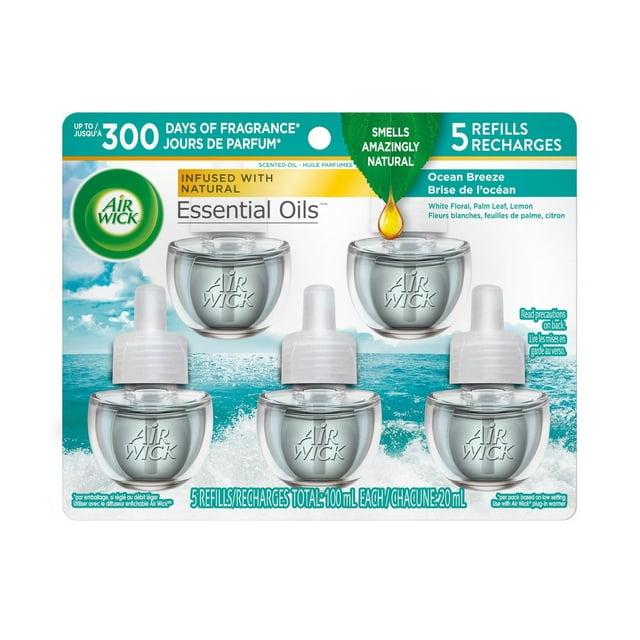 Five Air Wick Essential Oils scented oil refills in Ocean Breeze fragrance featuring white floral, palm leaf, and lemon notes