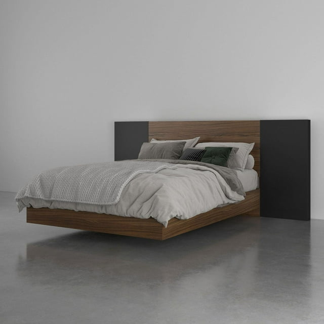 Dusk 3 Piece Bedroom Set, Walnut and Black with a floating walnut wood bed frame and black side panels on the headboard, featuring Nexera's metal and hardwood slat construction, styled with neutral grey bedding and assorted pillows on a polished concrete floor in a minimalist room.