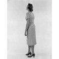 thumbnail image 2 of Studio shot of young woman wearing spotted dress Poster Print (18 x 24), 2 of 4