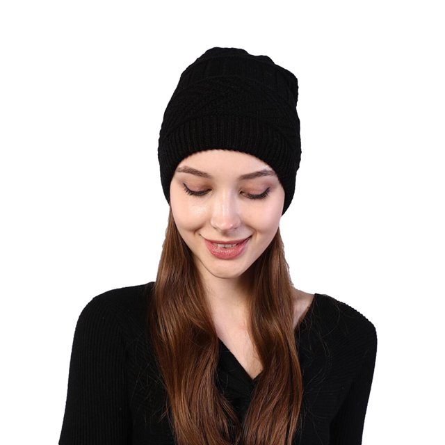 Scarf for Men Winter Warm 2-In-1 USB Heated Knitted Hat and Neck Gaiter Set. The image shows a black knitted hat worn by a model with long hair. The hat features a versatile design with a drawstring opening, allowing it to function as a hat, scarf, or neck warmer. Made from high-quality acrylic fibers with a fleece lining, it provides warmth and comfort. The USB-powered heating pad offers a safe and adjustable temperature range of 45-50°C, ideal for outdoor activities like skiing or hiking. Suitable for men and women.