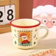 thumbnail image 4 of Taza navideña de cerámica de Papá Noel de 400 ml con tapa de silicona | Taza navideña para café y té | Regalo festivo para adultos y niños | Vaso duradero para celebraciones invernales, 4 of 6