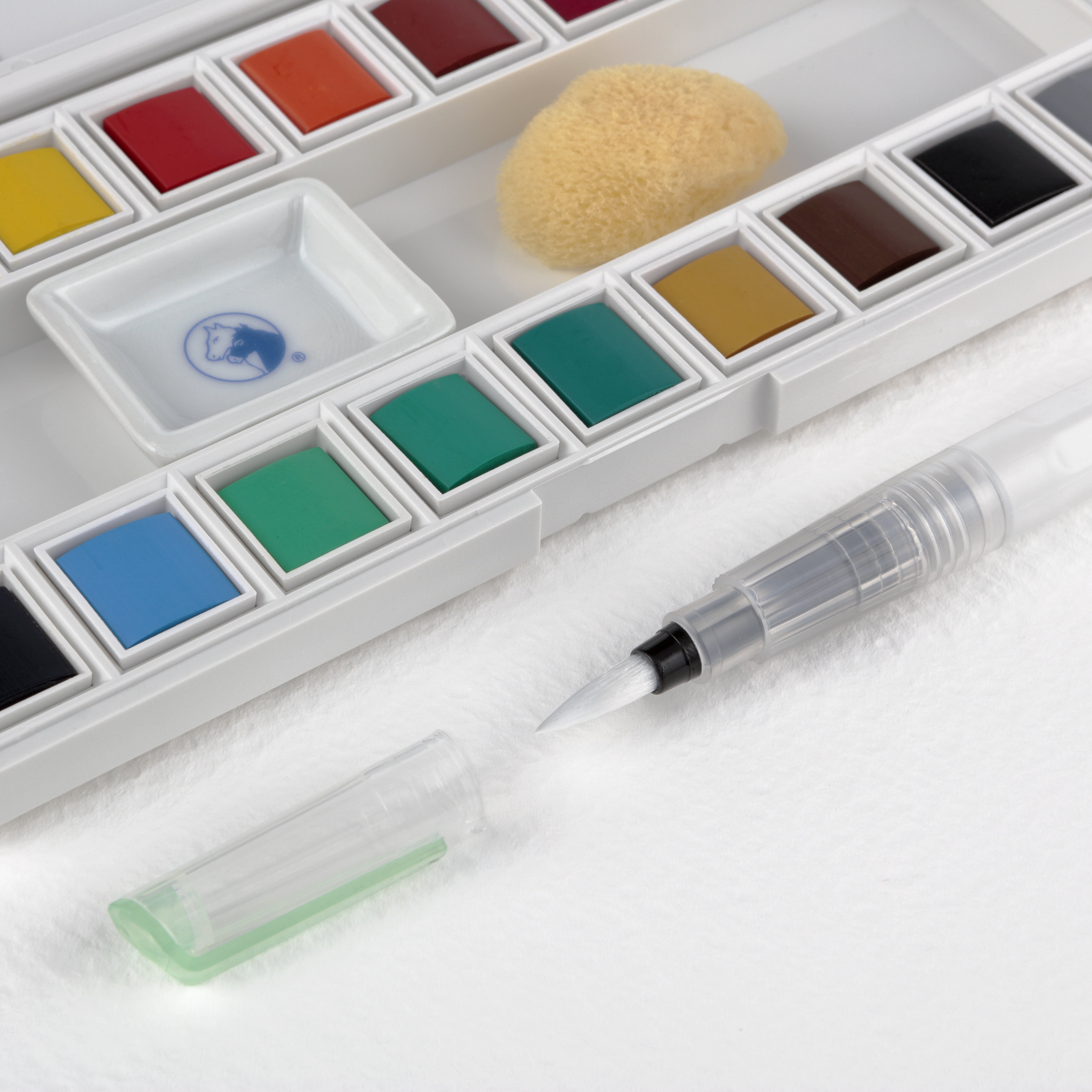 Marie's Artist Sketch & Go Watercolor Paint Set - Travel Friendly for Plein Aire or Studio - Includes a Palette Box with Mixing Area, Water Brush Pen, Natural Sponge - 18 Half Pans; Assorted Colors