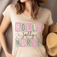 thumbnail image 4 of Holly Jolly Nurse Graphic T-Shirt with Fun Letter Design, Heliconia, Size 2XL, 4 of 6