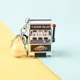 thumbnail image 1 of New Fashion Funny Game Decompression Slot Machine Playing Mini Fruit Handheld Non-toxic Desktop Money Box Kids Toy EntertainingSilver+Yellow BellNosize Gao Jinjia unisex, 1 of 2