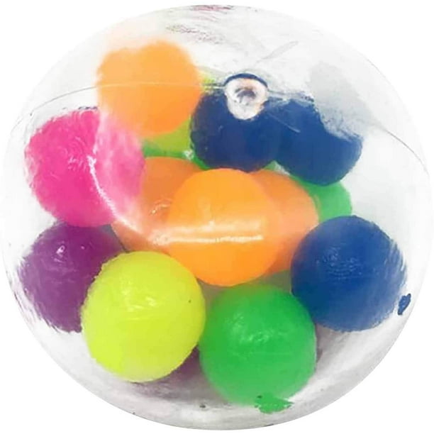 Teen boy playing with anti stress sensory ball squeeze toy. Giant stress  balls are soft to