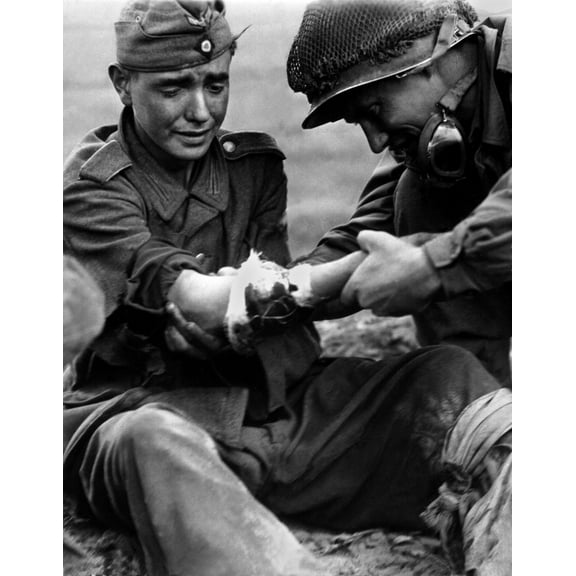 Teenage German Pow'S Arm Wound Is Examined By An Older American Soldier. In The Last Year Of The World War 2 History (