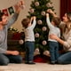 thumbnail image 5 of Juego de 30 adornos navideños con formas variadas que incluyen bolas, bastones de caramelo y cintas para decorar el árbol de Navidad. NCHKUN, 5 of 9