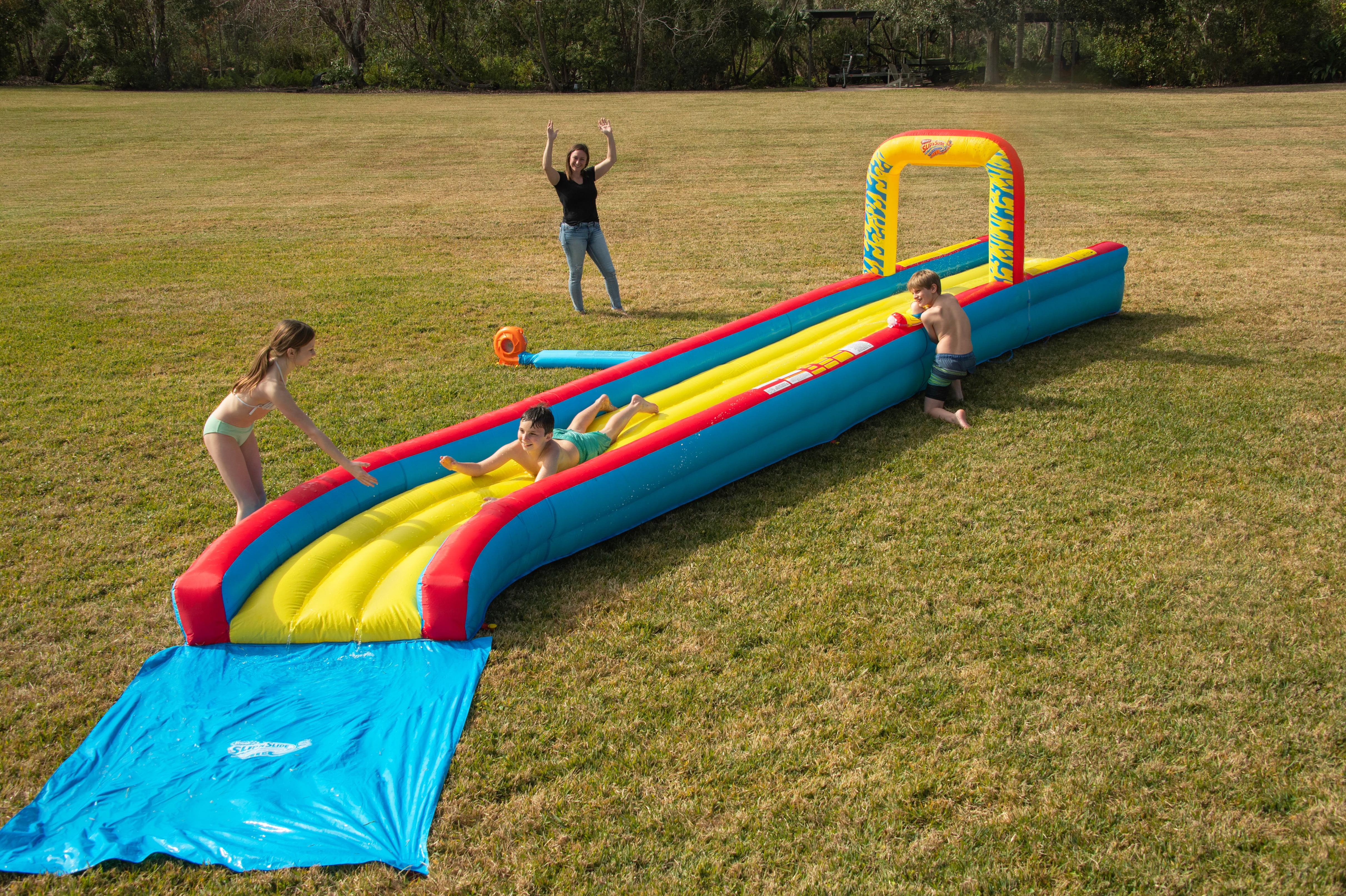 Wham-O 30-Foot Constant Air Slip N Slide Inflatable Water Slide with Blower, Air-Cushioned Track, Waterfall Splash, Water Cannon, Ages 5-12, 1-Count