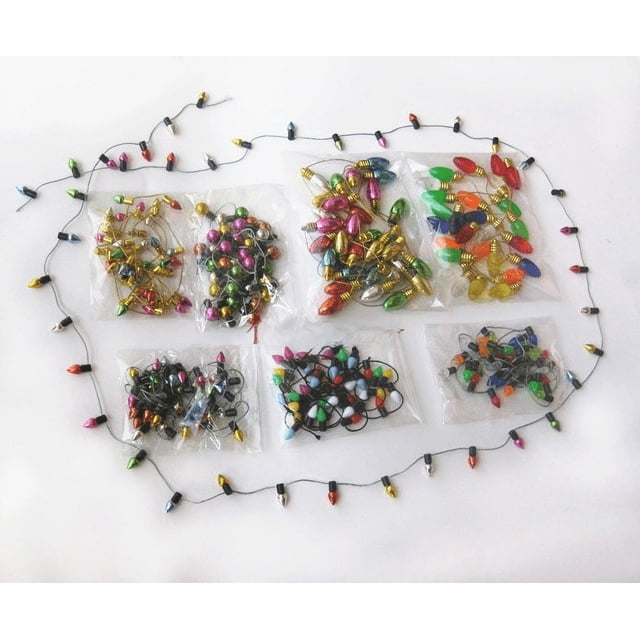 Una variedad de decoración navideña, cadena de luces pequeña galvanizada, mini bombilla transparente, bolsa de joyería de cuentas de un metro sin alimentación