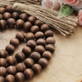 thumbnail image 5 of Efavormart Farmhouse Decor 55"" Brown Wood Bead Garland with Tassels Rustic Country Boho Decor Prayer Wood
Beaded Chain Big Wall Hanging Decor for Home Indoor& Outdoor Events, 5 of 11