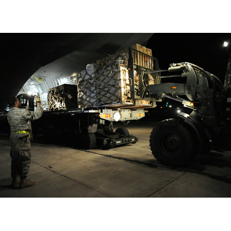 LAMINATED POSTER Equipment is unloaded from a Charleston C-17 in Port-au-Prince, Haiti Jan. 15, 2010. The supplies ar Poster Print 24 x